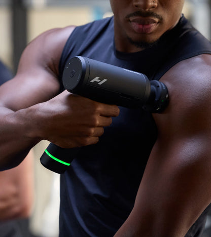 Athlete using Hypervolt 3 Pro on his upper arm